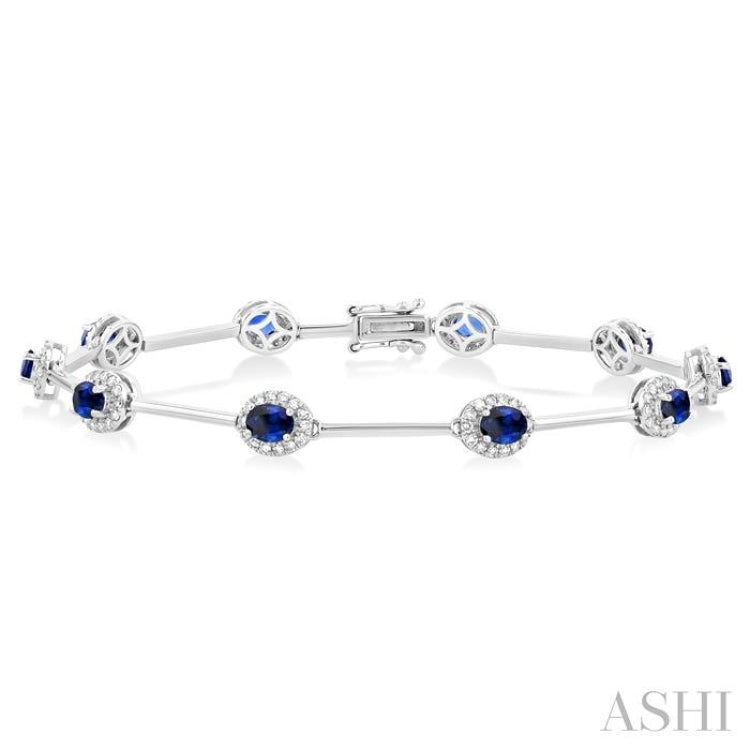 4x3 MM Oval Cut Sapphire and 1/2 ctw Round Cut Diamond Halo Precious Bar Link Bracelet in 10K White Gold