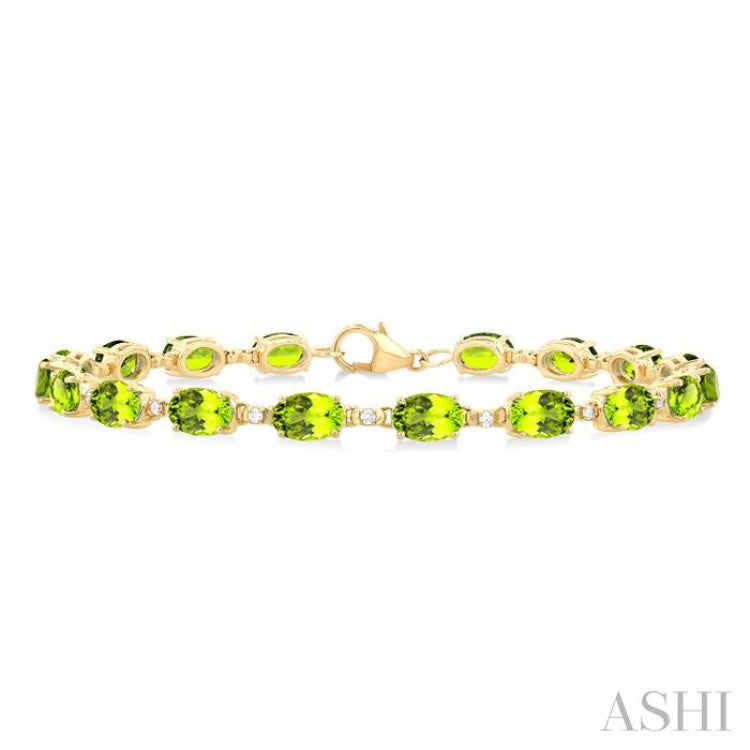 6X4 MM Oval Cut Peridot and 1/6 ctw Round Cut Diamond Semi Precious Tennis Bracelet in 10K Yellow Gold