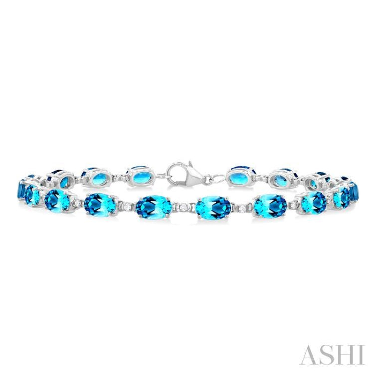 6X4 MM Oval Cut Blue Topaz and 1/6 ctw Round Cut Diamond Semi Precious Tennis Bracelet in 10K White Gold