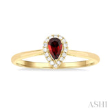 5x3 MM Pear Shape Garnet and 1/20 ctw Single Cut Diamond Halo Semi Precious Ring in 14K Yellow Gold