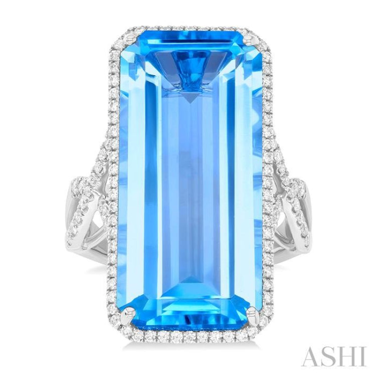26x12 MM Emerald Cut Blue Topaz and 1/2 ctw Round Cut Diamond Halo Semi Precious Ring in 14K White Gold