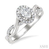 1/2 Ctw Twisted Shank Round Cut Diamond Halo Engagement Ring With 1/3 Ct Oval Cut Diamond Center Stone in 14K White Gold