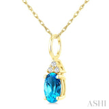 1/50 Ctw Oval Cut 6X4 MM Blue Topaz and Round Cut Diamond semi-precious Pendant With Chain in 10K Yellow Gold