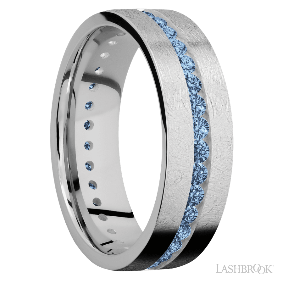 7 mm wide/Flat/14K White Gold band with an Eternity arrangement of 03 carat Round Denim Sapphire stones in a Channel setting