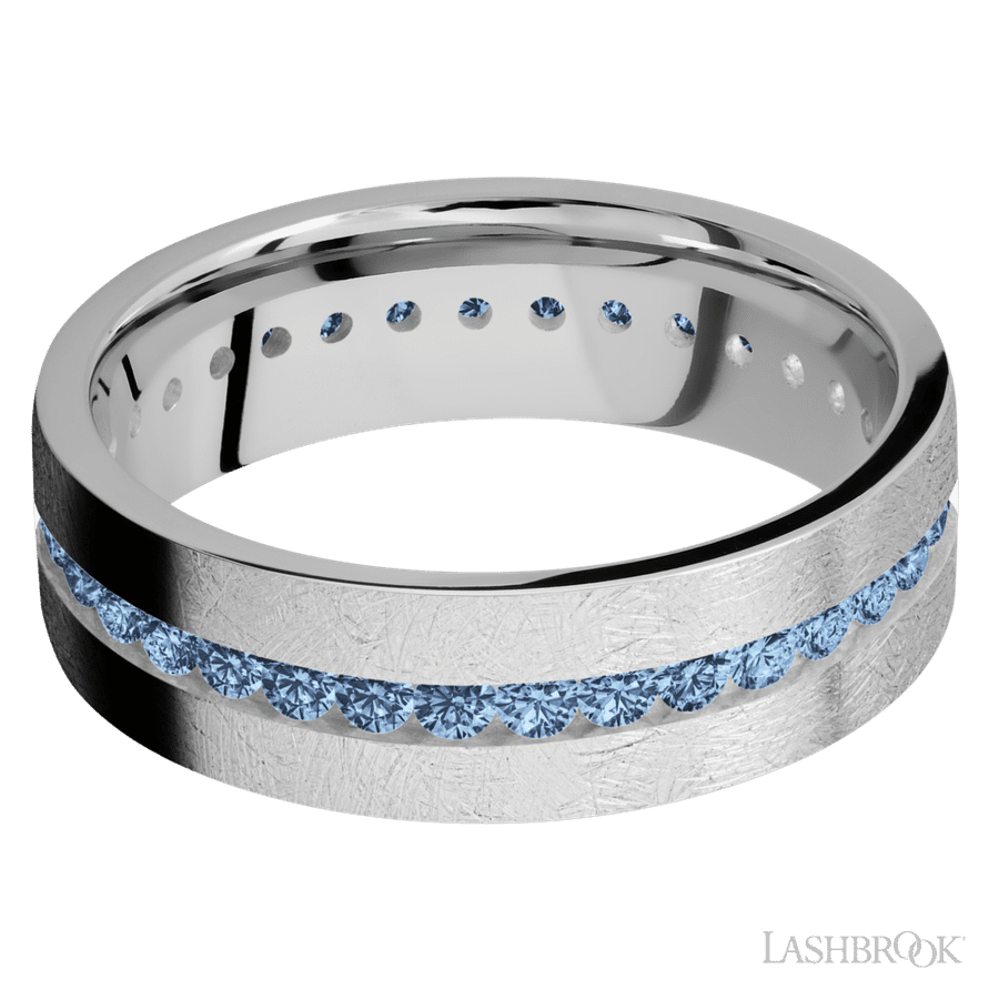 7 mm wide/Flat/14K White Gold band with an Eternity arrangement of 03 carat Round Denim Sapphire stones in a Channel setting