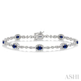 5x3MM Oval Cut Sapphire and 1/20 Ctw Single Cut Diamond Bracelet in 10K White Gold