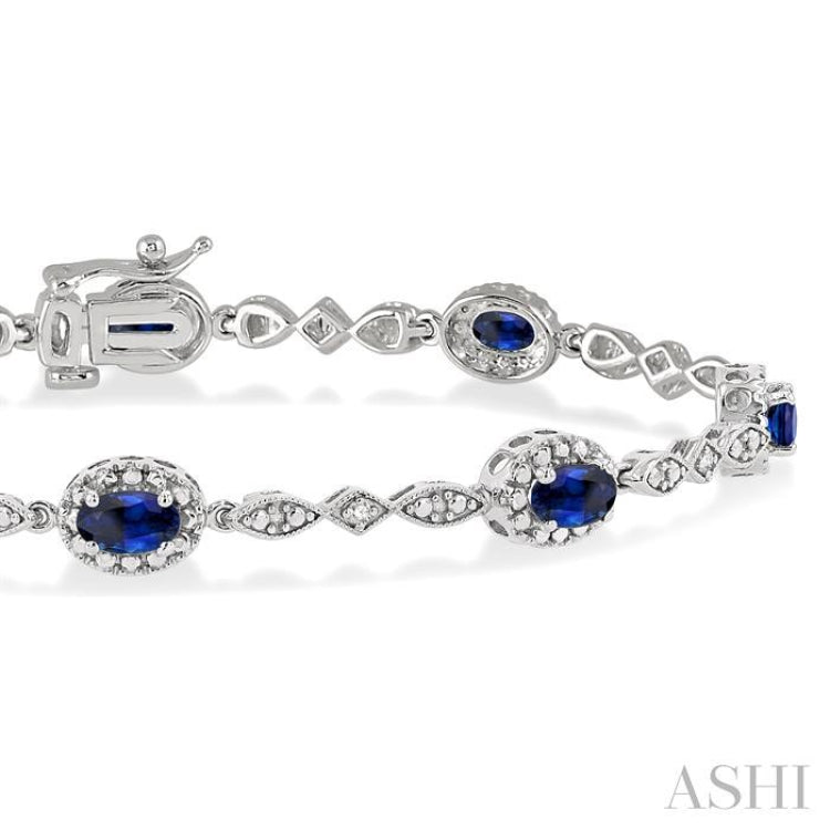 5x3MM Oval Cut Sapphire and 1/20 Ctw Single Cut Diamond Bracelet in 10K White Gold
