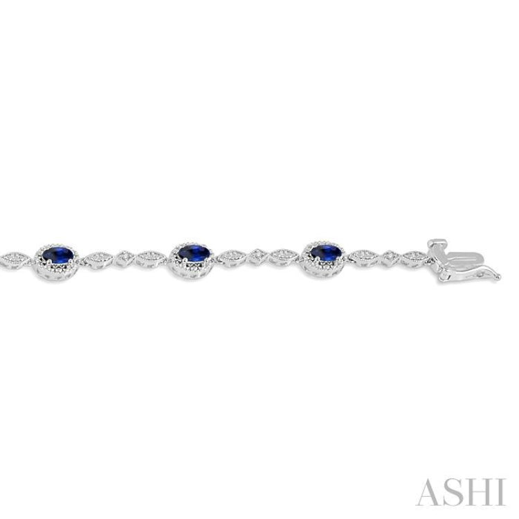 5x3MM Oval Cut Sapphire and 1/20 Ctw Single Cut Diamond Bracelet in 10K White Gold