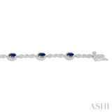 5x3MM Oval Cut Sapphire and 1/20 Ctw Single Cut Diamond Bracelet in 10K White Gold