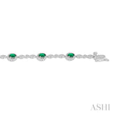 5x3 MM Oval Cut Emerald and 1/20 Ctw Single Cut Diamond Bracelet in 14K White Gold