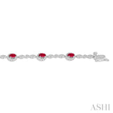 5x3MM Oval Cut Ruby and 1/20 Ctw Single Cut Diamond Bracelet in 14K White Gold