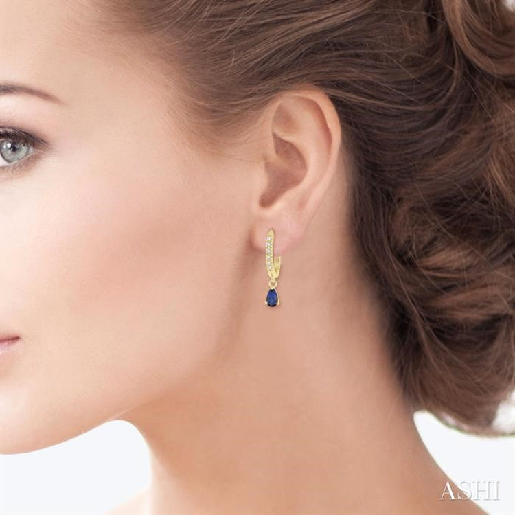 1/8 ctw Round Cut Diamond & 5x3MM Pear Cut Sapphire Petite Fashion Huggie Earrings in 10K Yellow Gold