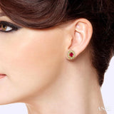 4x3 MM Oval Shaped Ruby and 1/10 Ctw Round Cut Diamond Earrings in 10K Yellow Gold