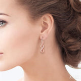 1/6 ctw Round Cut Diamond Infinity Petite Earrings in 10K Rose Gold