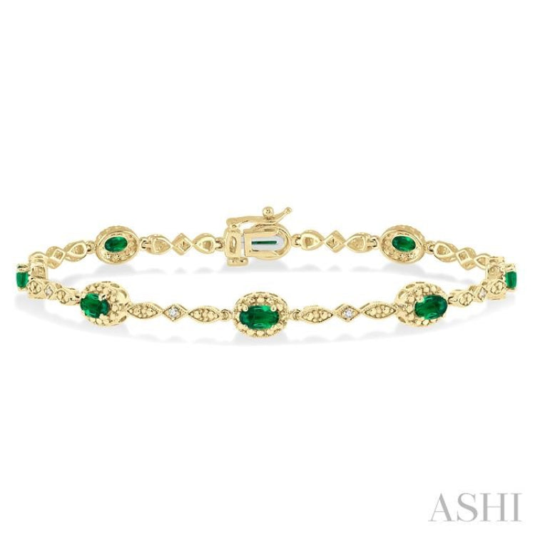 5x3 MM Oval Cut Emerald and 1/20 Ctw Round Cut Diamond Bracelet in 10K Yellow Gold