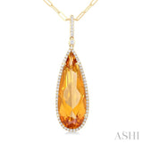 26x9 MM Pear Cut Citrine and 1/4 ctw Round Cut Diamond Halo Semi Precious Pendant With Chain in 14K Yellow Gold
