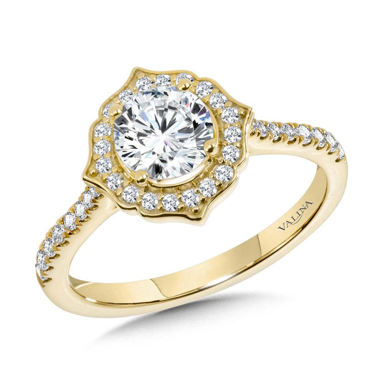An art deco diamond halo frames the classic round center stone, resting above a sleek 1/2 diamond shank.