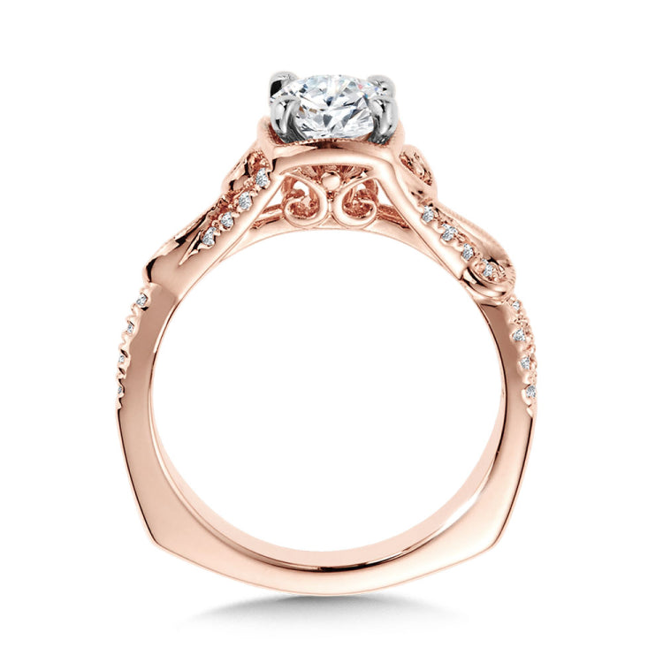Diamond engagement ring mounting with side stones set in 14k rose gold.