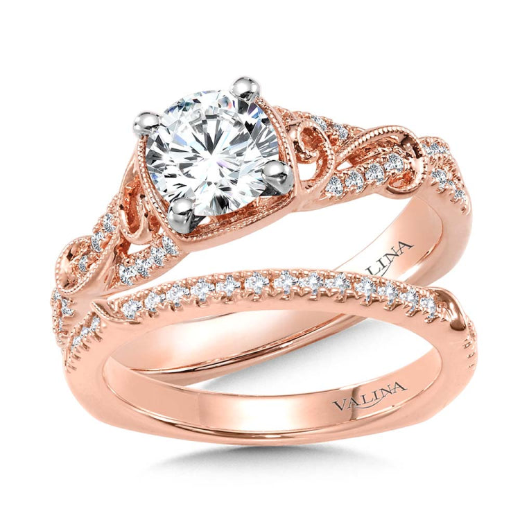Diamond engagement ring mounting with side stones set in 14k rose gold.