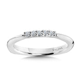 Five petite shared-prong diamonds decorate the top of this otherwise sleek and slim golden true fit matching wedding band.