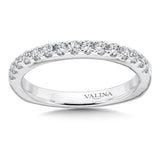 Wedding band with a delicate band of diamonds set in 14k white gold.